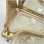 compact in the form of a grand piano