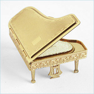 compact in the form of a grand piano