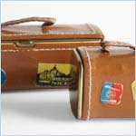 compact and lipstick cases in the forms of miniature luggage