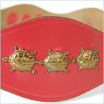 belt shapes of turtles and a frog