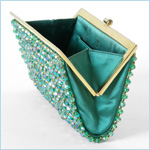 Dazzling, green satin clutch bag