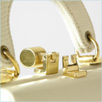 Petite, ivory leather evening bag with reptile print 
