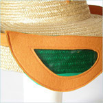 Fun, woven wicker box bag decorated with oversized felt sunglasses and su