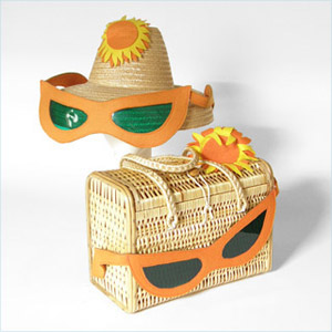 Fun, woven wicker box bag decorated with oversized felt sunglasses and su