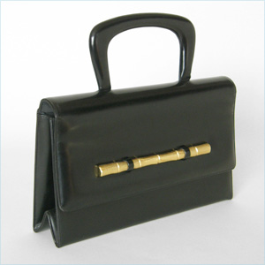 black leather handbag with gold bamboo accen