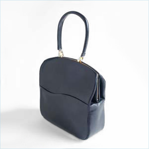 Sleek, navy leather handbag with unique clasp